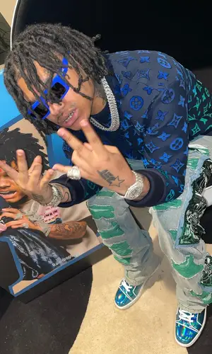 No Cap wearing Louis Vuitton sweatshirt