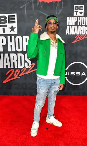 Benny The Butcher wearing Amiri jeans