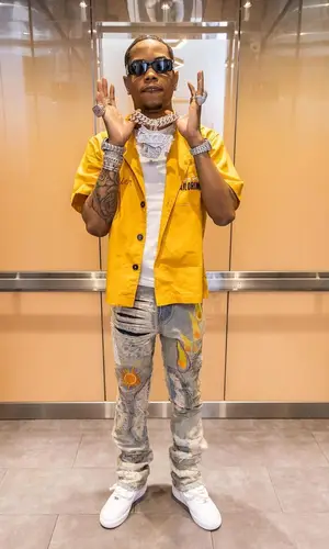 Lil Migo wearing Nike sneakers
