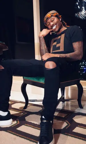 Duke Dennis wearing Fendi scarf