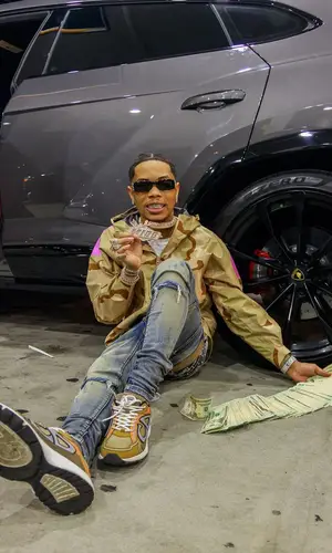 Lil Migo wearing Goyard bag