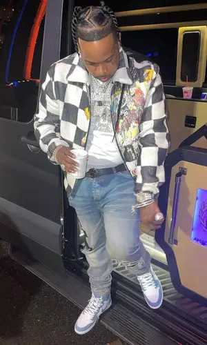 Finesse2tymes wearing Gucci belt