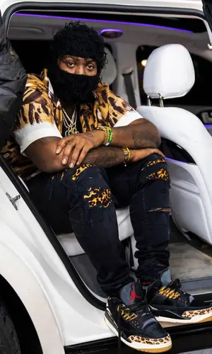 Peezy wearing Marni shirt