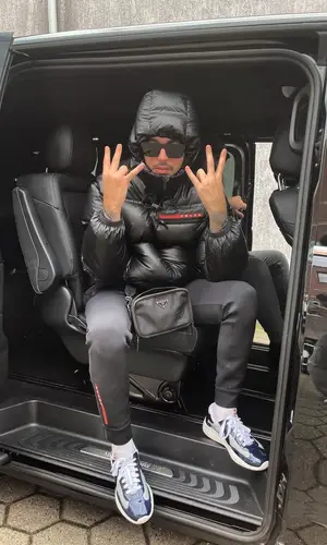 Kalim wearing Prada jacket
