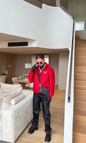 Kalim wearing Prada jacket