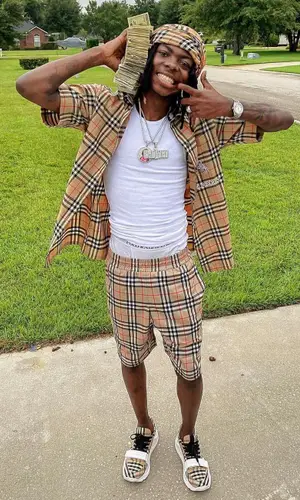 Dee Watkins wearing Burberry shirt