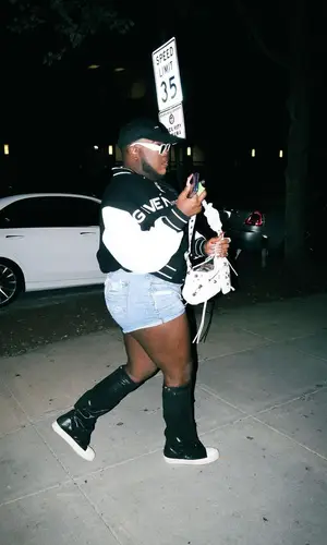 Saucy Santana wearing Givenchy jacket