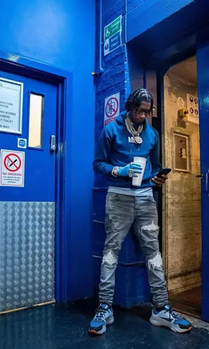 Digga D wearing Digga D Merch hoody
