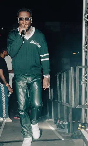 Burna Boy wearing Valentino sweater
