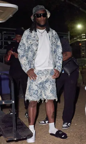 Burna Boy wearing Louis Vuitton hat