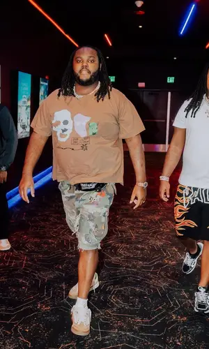 Tee Grizzley wearing Gallery Dept. shorts