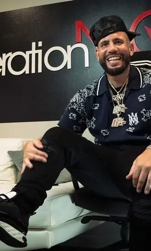 DJ Drama wearing Amiri jeans