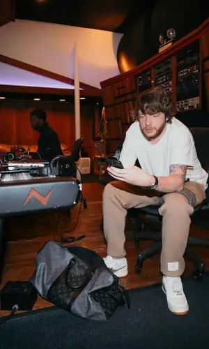 Murda Beatz wearing Louis Vuitton bag