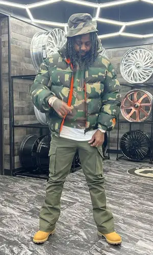 Babyface Ray wearing Heron Preston hat