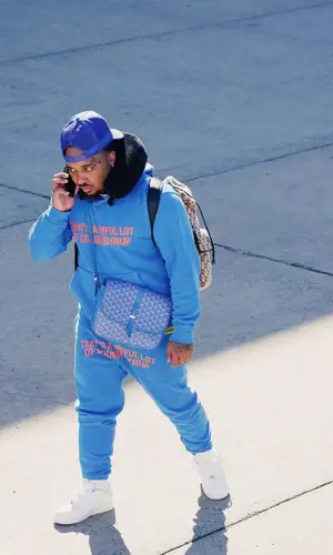 Doe Boy wearing Goyard bag