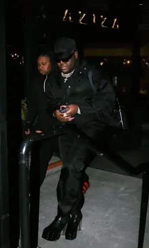Saucy Santana wearing Prada cap
