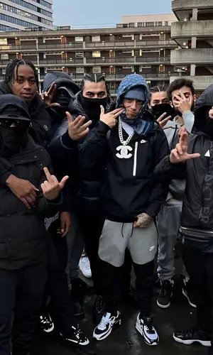Central Cee wearing Louis Vuitton scarf