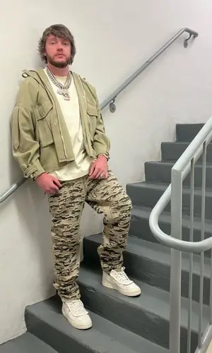 Murda Beatz wearing Givenchy jeans