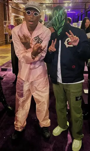 Pharrell Williams wearing Prada pants