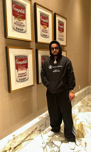 Nav wearing Balenciaga pants