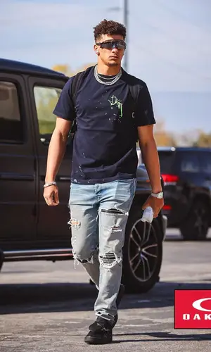 Patrick Mahomes II’s Outfit in Cactus Jack T-Shirt, Dior Backpack & Oakley Eyewear (2022)