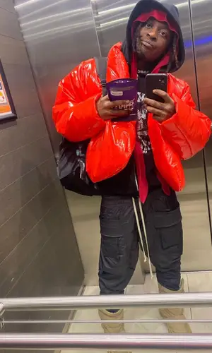 UnoTheActivist wearing Yeezy boots