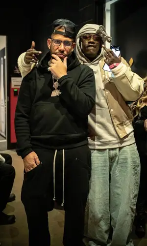DJ Drama wearing Amiri hoody