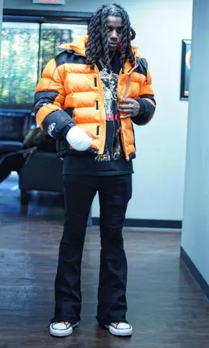 OMB Peezy wearing Valabasas jeans