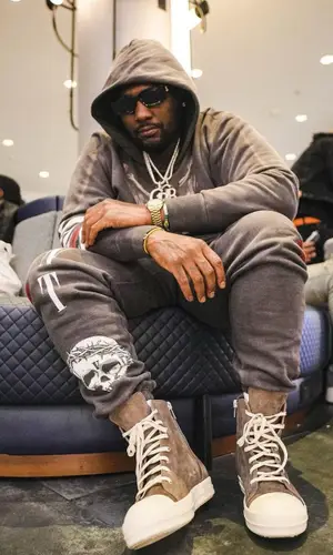 Peezy wearing Vlone pants