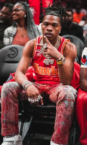 Lil Baby wearing Atlanta Hawks jersey