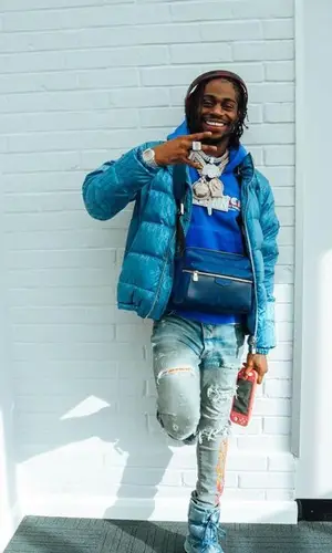Russ Millions wearing Amiri hoody