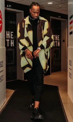 Precious Achiuwa wearing Issey Miyake jacket