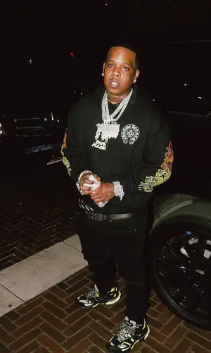 Finesse2tymes wearing Chrome Hearts hoody