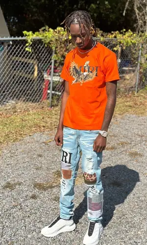 StickBaby Juan wearing Amiri jeans