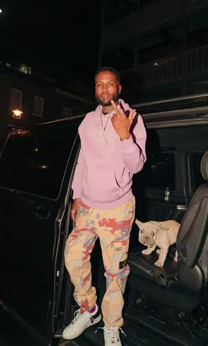 Shy Glizzy wearing Undercover sneakers