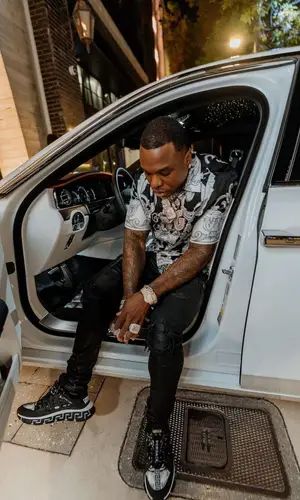 BandMan Kevo wearing Versace shirt