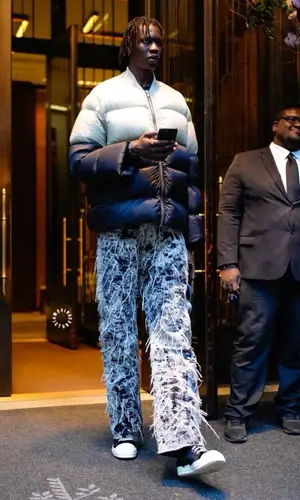 Bol Bol wearing Ends Repair jeans