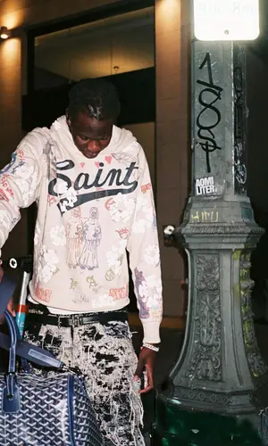 Bol Bol wearing Goyard bag