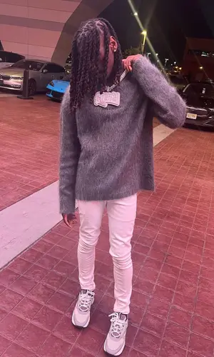 SleazyWorld Go wearing Givenchy sweater
