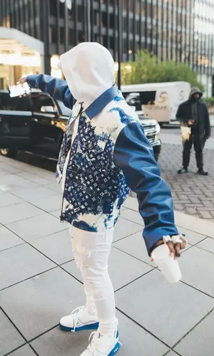 DaBaby wearing Louis Vuitton jacket