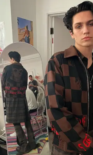 Lil Huddy wearing Amiri jacket