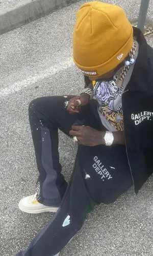 Sauce Walka wearing Supreme hat
