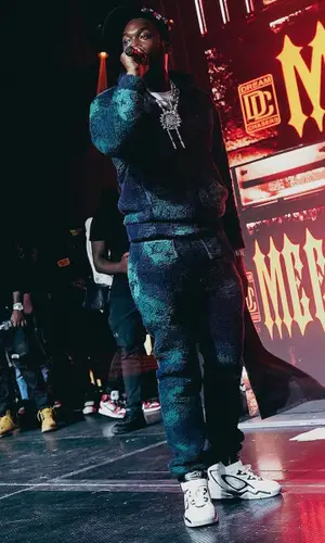 Meek Mill wearing Louis Vuitton sweatshirt