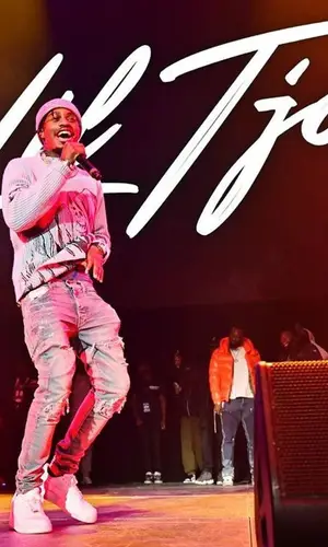 Lil Tjay wearing Amiri sweater