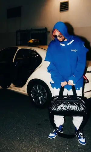 Lil Lano wearing Nike sneakers