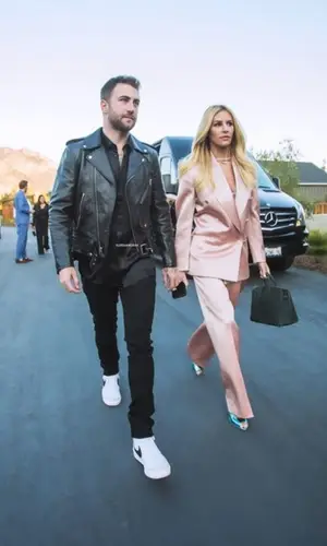 Morgan Stewart wearing Gucci pants