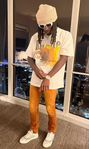 SleazyWorld Go wearing Rhude t-shirt