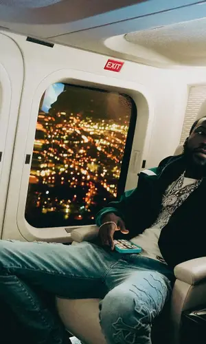Meek Mill wearing Louis Vuitton jacket