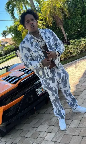Finesse2tymes wearing Denim Tears jeans