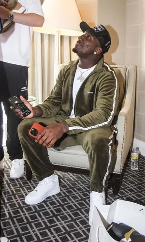 Deebo Samuel’s Outfit in Supreme Jacket, Nike Sneakers & Chrome Hearts Cap (2022)